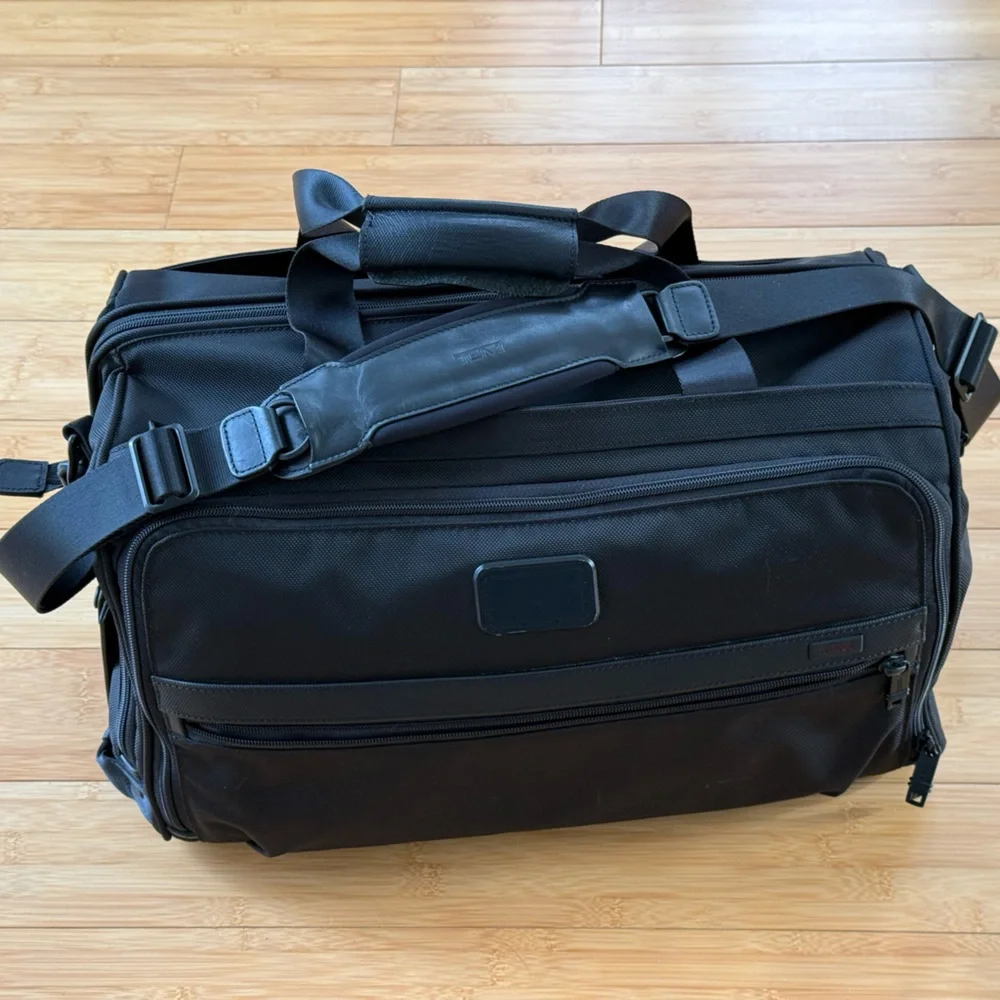 Tumi Black Duffel Bag with Adjustable Shoulder Strap